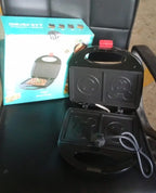 Retail packaging box for the FirePot 750W electric sandwich maker, ready for gifting.