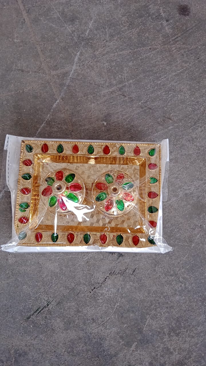 Vertical shot of the festive Raksha Bandhan Pooja Thali with kumkum holder.