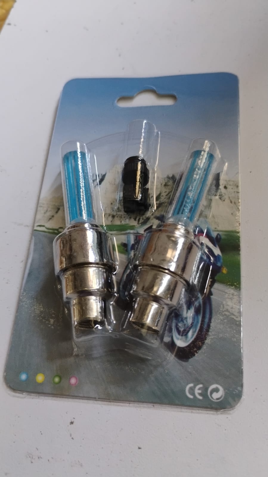 Step-by-step diagram illustrating the easy installation process for LED tire valve caps.