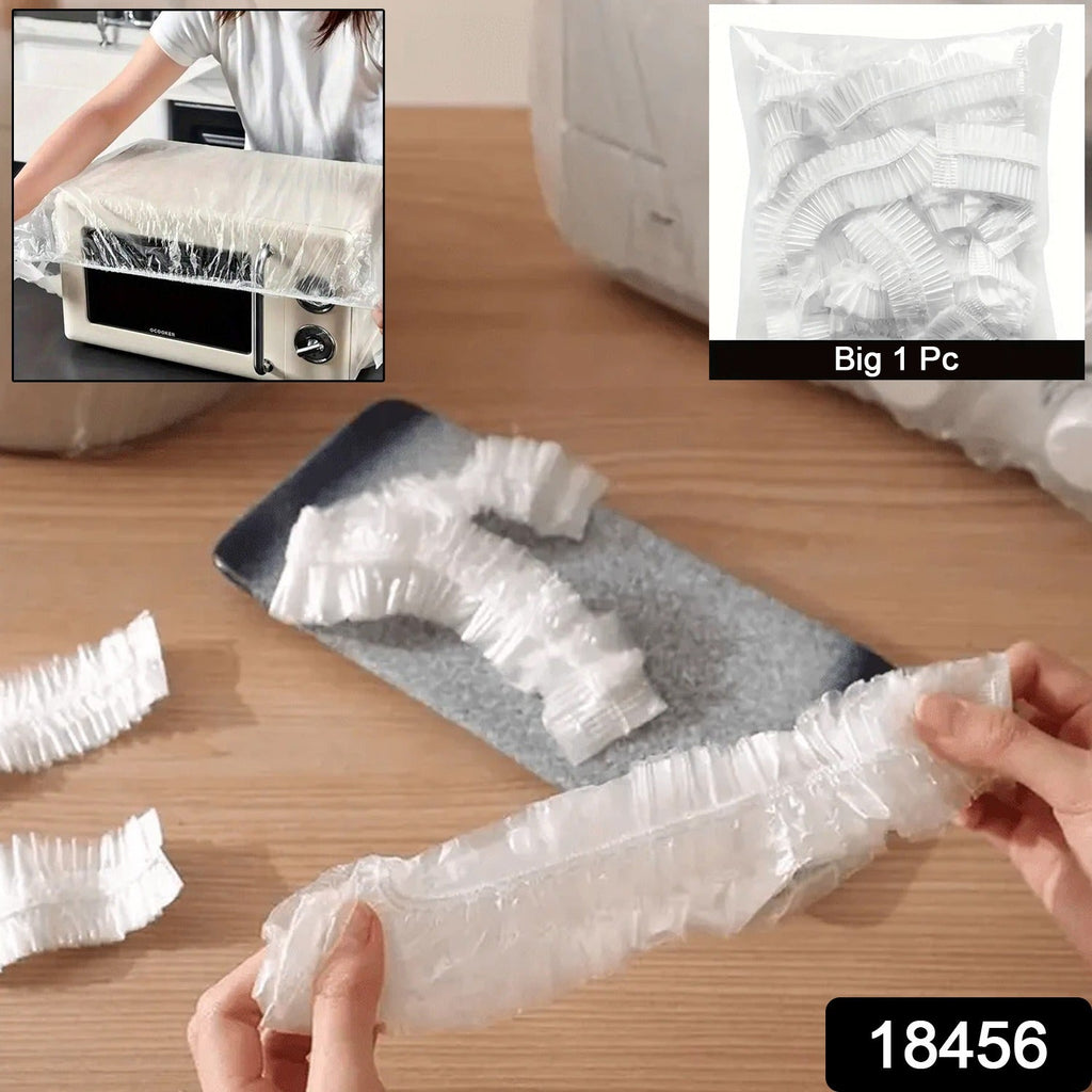 A large dining table covered with a clear disposable furniture protector.