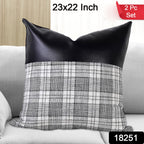 Two 23x22 inch Leather & Cotton Pillow Covers displayed on a bed.