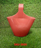 Single hanging planter pot on a balcony railing.