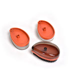 Compact wet and dry brush removing dirt from a fabric item.