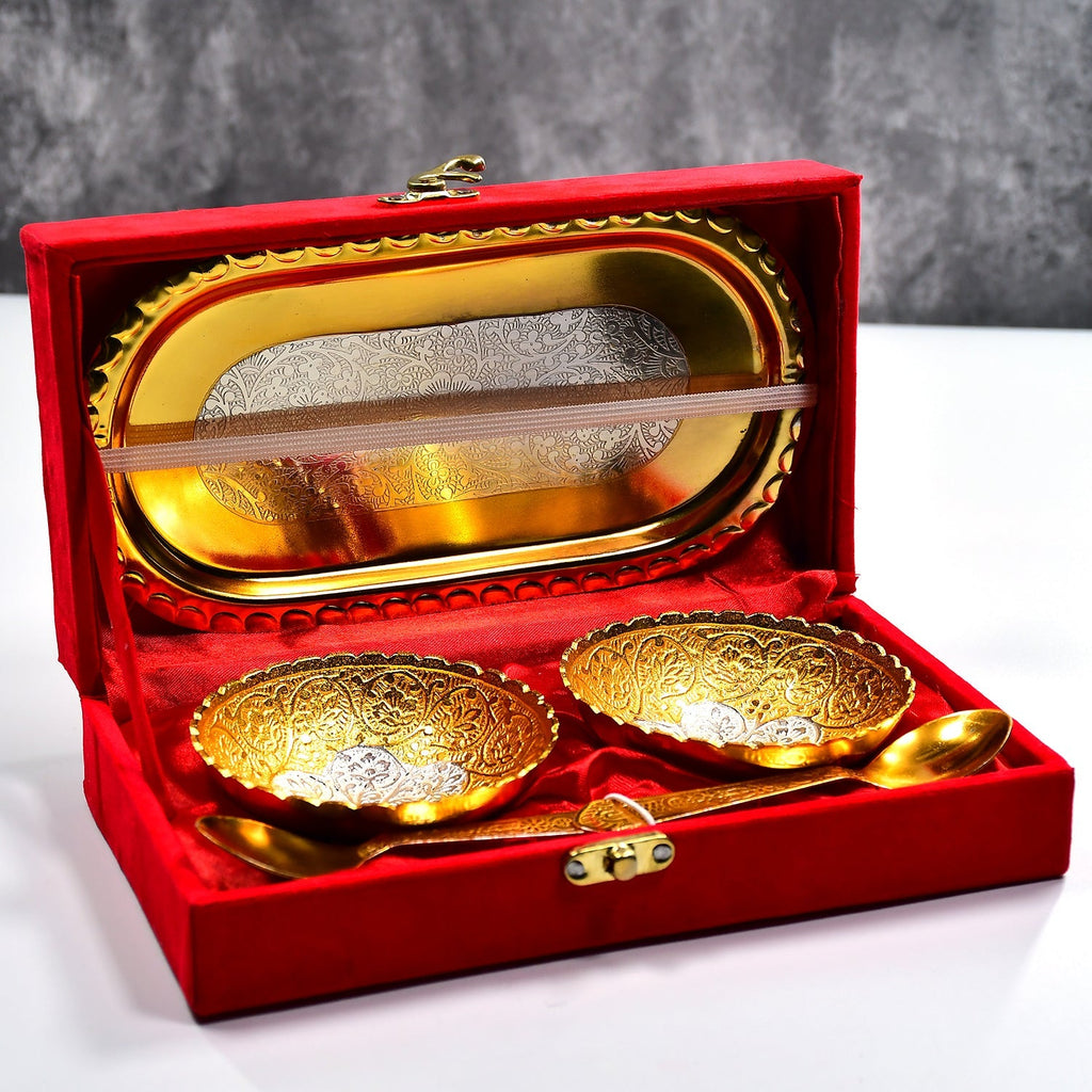 Elegant gold and silver plated brass serving set with two bowls, two spoons, and a red velvet gift box.