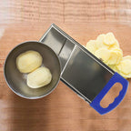 Household potato slicer designed for easy and efficient vegetable cutting.