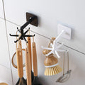 Black rotatable hooks with six prongs ideal for kitchen utensil storage
