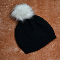Unisex slouchy beanie cap in black with a skull design and warm fur lining.