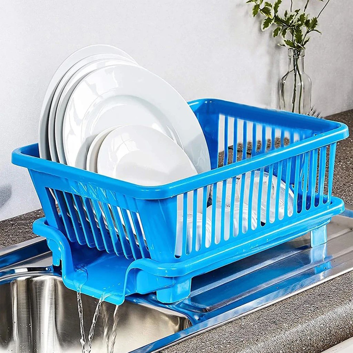 Plastic dish drainer rack with utensil holder in a brown box for kitchen organization.