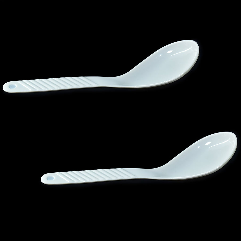 Neatly arranged 32-piece plastic tableware set, ideal for serving meals.