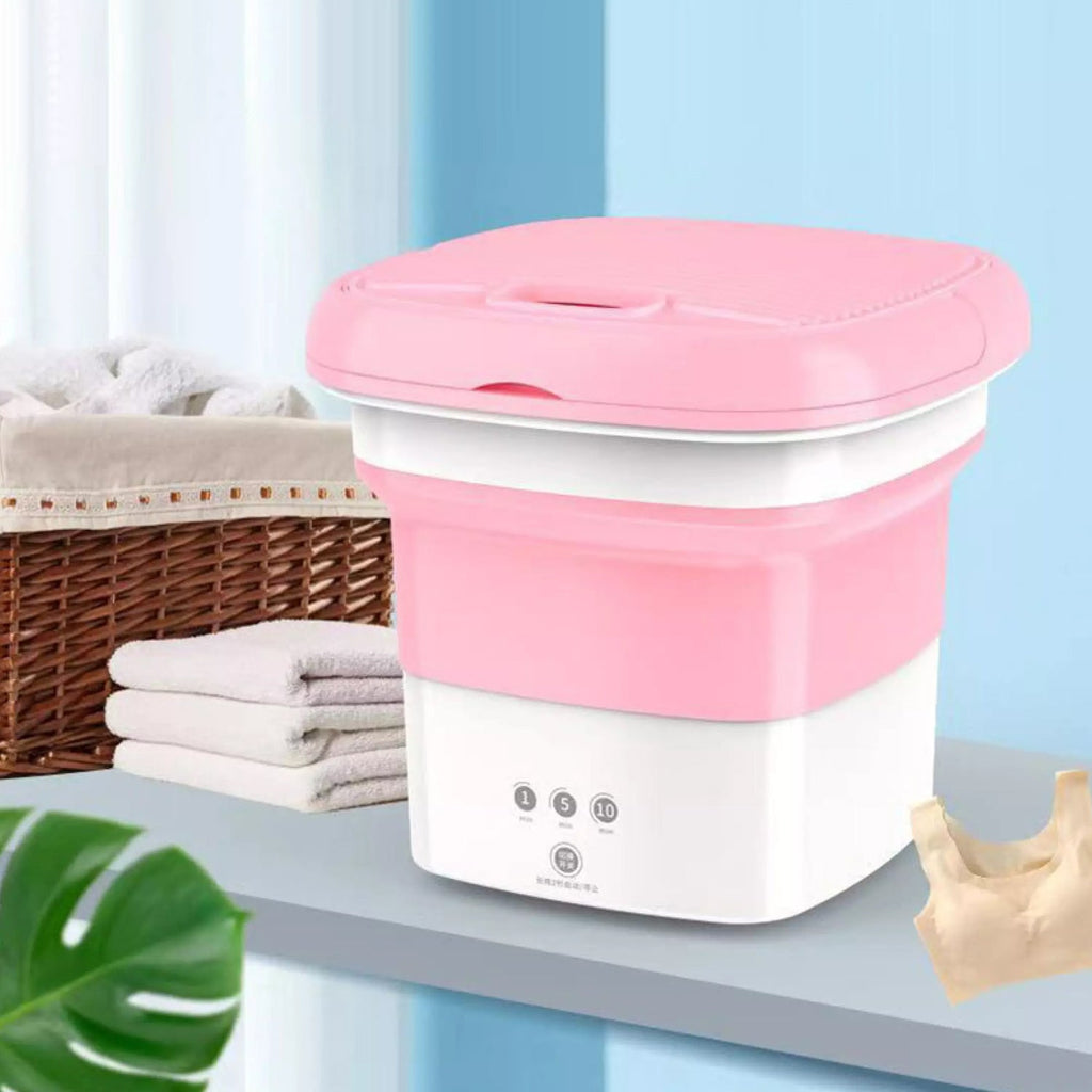Mini foldable washing machine in use, cleaning clothes.