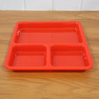 Ergonomic design of the plastic 3-compartment meal serving tray.