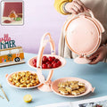 3-layer foldable snack serving stand with round trays displaying fruits and snacks