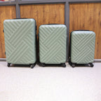 Complete set of three hard case travel suitcases, ideal for family trips.