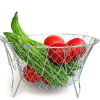 Stainless steel strainer basket with ergonomic handles for safe and easy lifting from hot liquids.