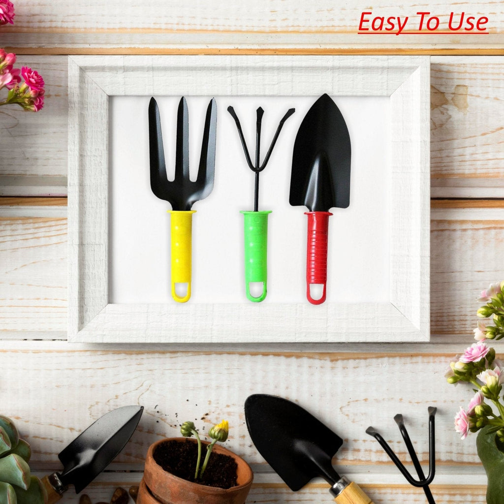 Assorted colorful gardening hand tools displayed together for scale.