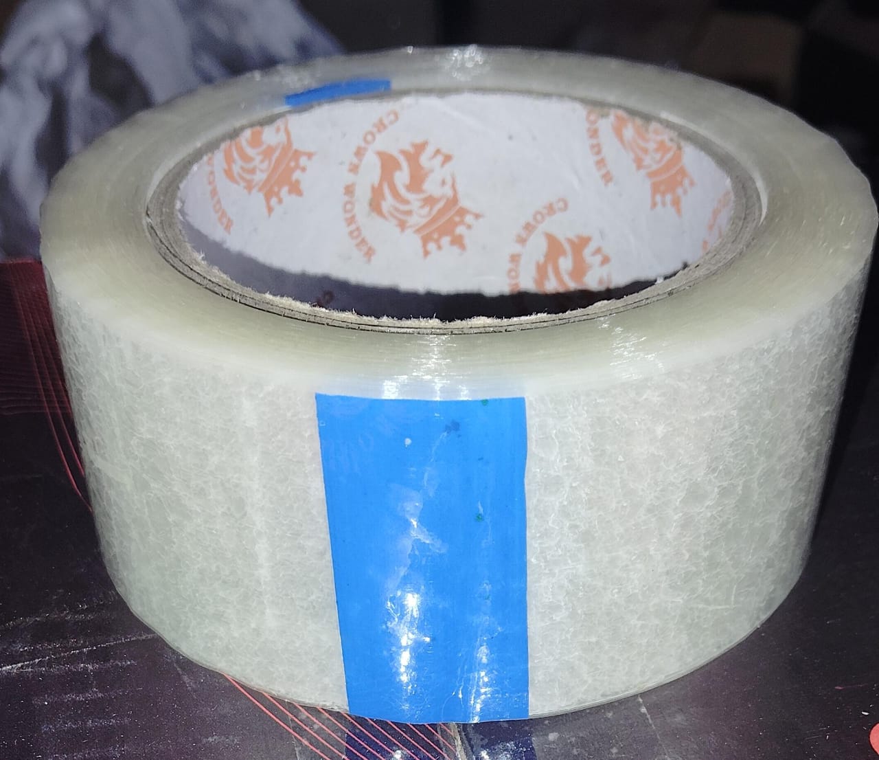 Roll of transparent cello tape, perfect for general purpose sealing.