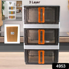Stacked plastic folding storage organizers in contrasting colors showcasing modular design.