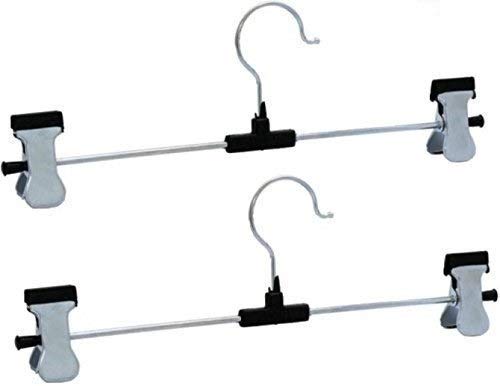 Organized wardrobe section showcasing clothes neatly hung on stainless steel hangers.
