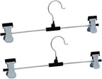 Organized wardrobe section showcasing clothes neatly hung on stainless steel hangers.