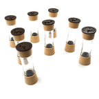 The revolving spice rack placed on a dining table, ready for use during a meal.