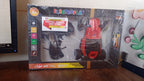 Remote control racing car in red accompanied by ergonomic pistol-grip controller