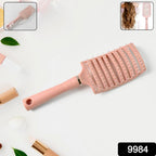 Side view of massage hair comb with ergonomic handle and ball-ended bristles