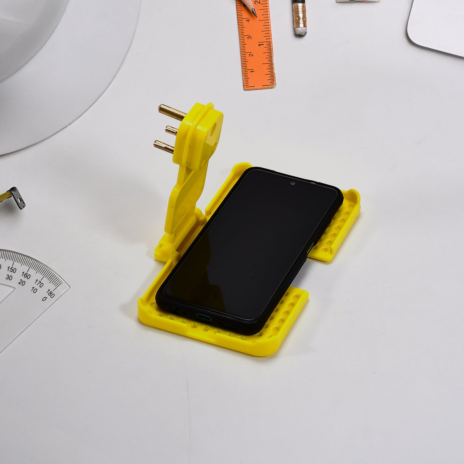Side angle of the multi-purpose mobile charging wall holder with ventilation slots.