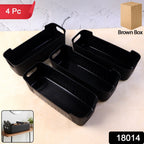 Close-up view of black plastic storage basket trays with handles