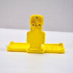 Back view of the PHOBIA yellow mobile charging wall holder, ready for installation.