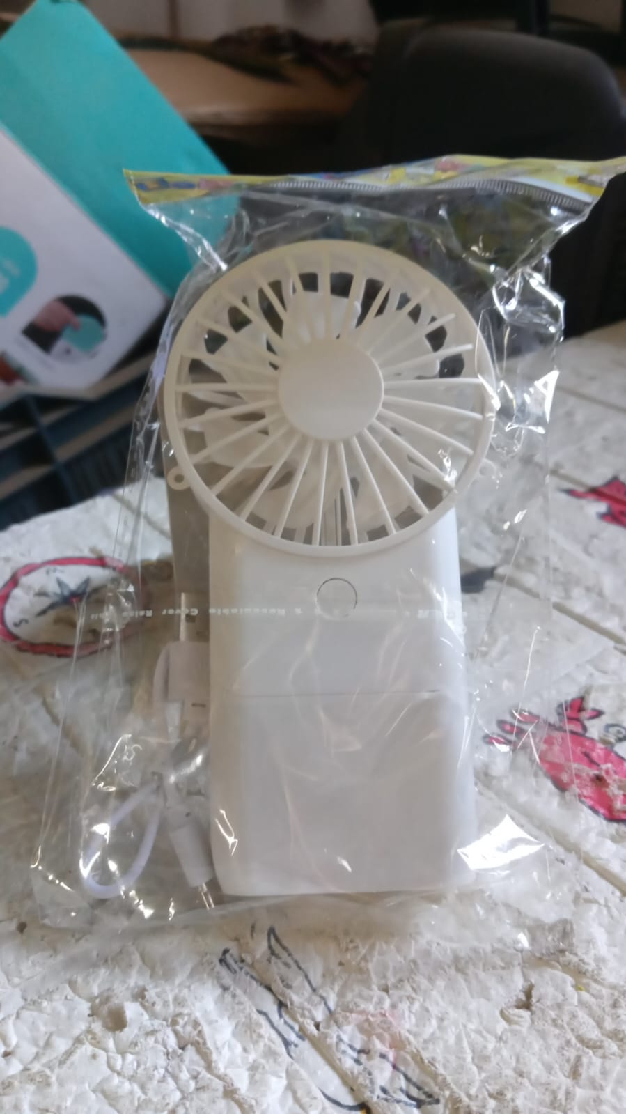 Detailed view of the fan's protective grille and blades, highlighting its design.