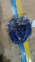 Detailed view of the durable connectors on the expandable garden hose.