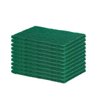 A hand holding a green scrubber pad, demonstrating its flexible and ergonomic design.
