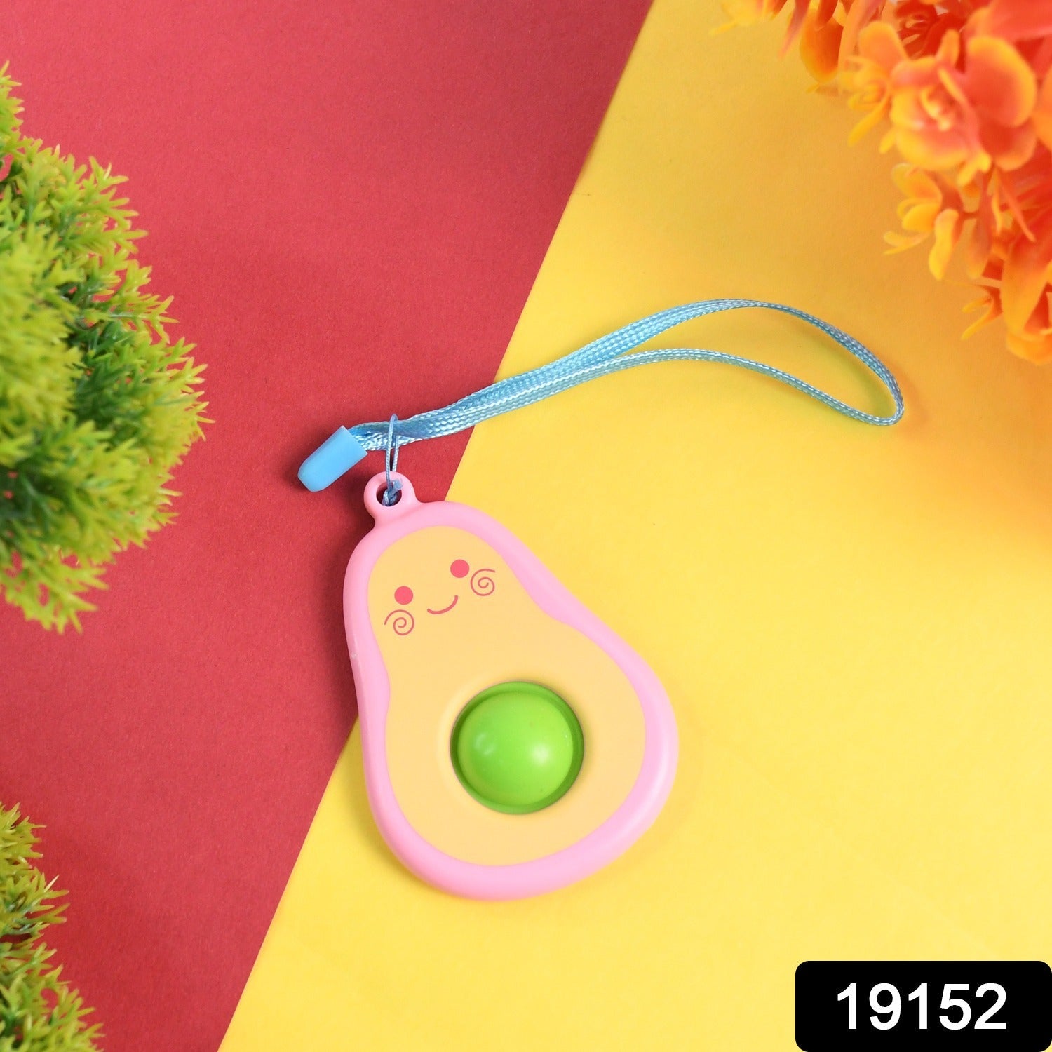 Bright avocado bubble pop toy attached to durable strap
