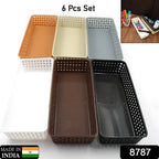 Multipurpose desk organizer trays neatly arranged inside a drawer with various items.