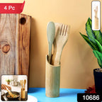 Natural bamboo cooking utensils including spatulas and holder used in cooking