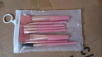 A close-up view of the secure aluminum ferrules connecting bristles to handles on the makeup brushes.
