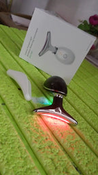 Woman applying the Neck Face Massager to her jawline for a lifting effect.