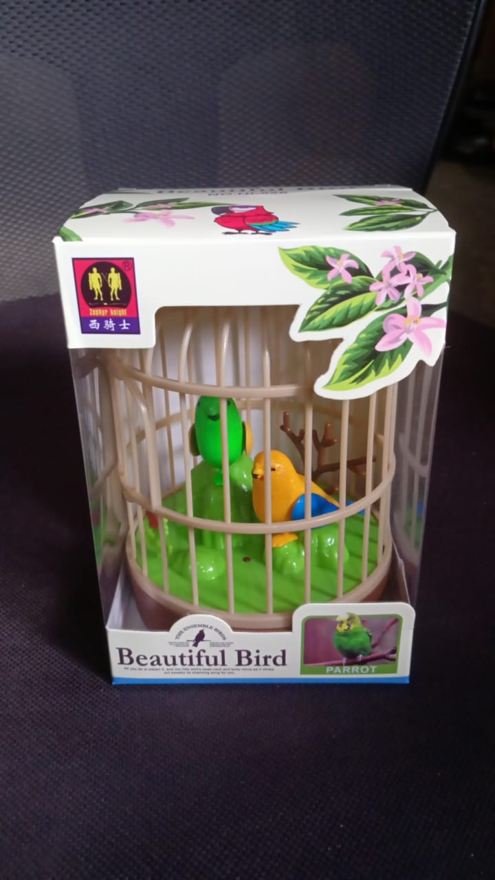 Packaging for the Spark Tots sound-activated chirping bird toy.