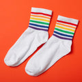 A vibrant assortment of Printed Designer Socks showcasing various patterns and colors.