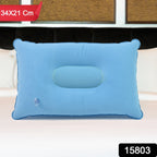 Compact inflatable travel pillow being used during travel for neck support