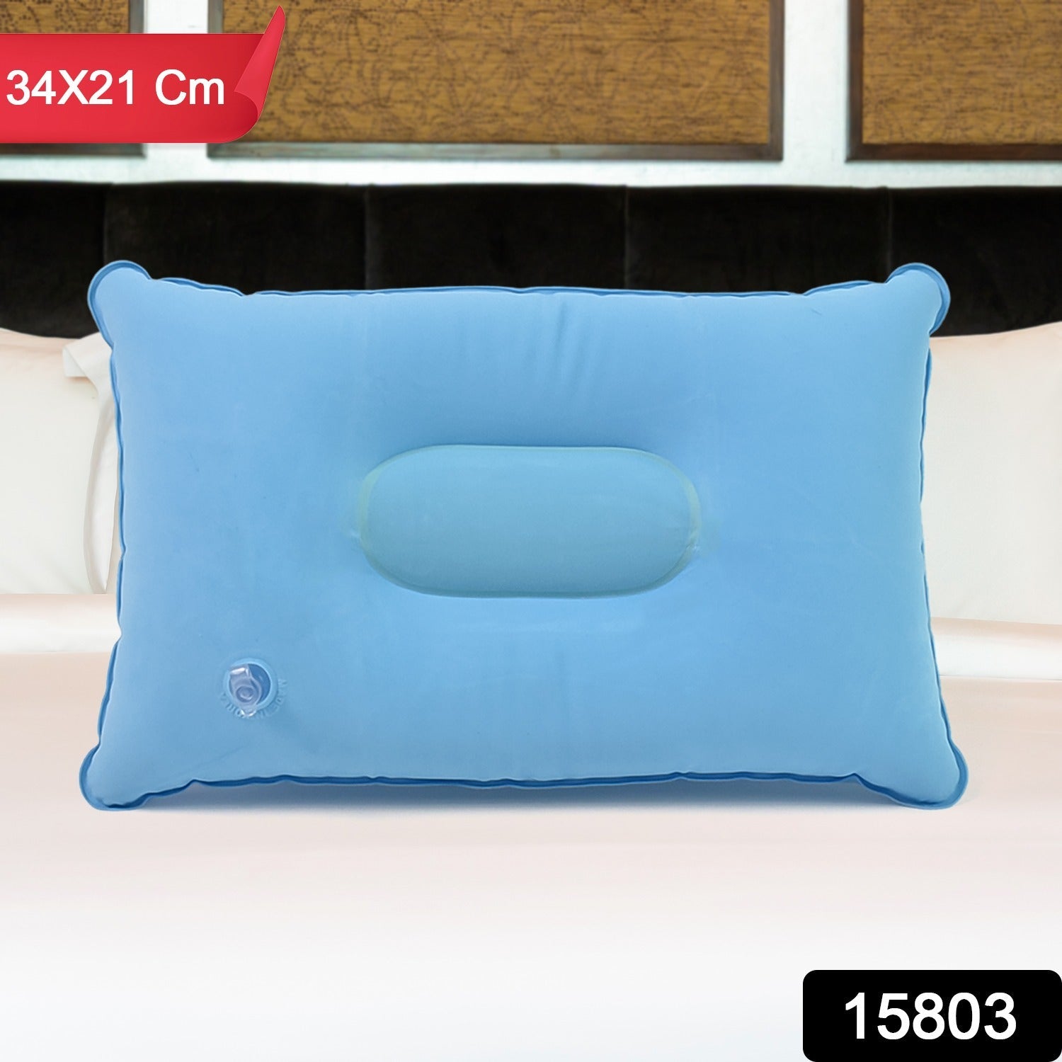 Compact inflatable travel pillow being used during travel for neck support