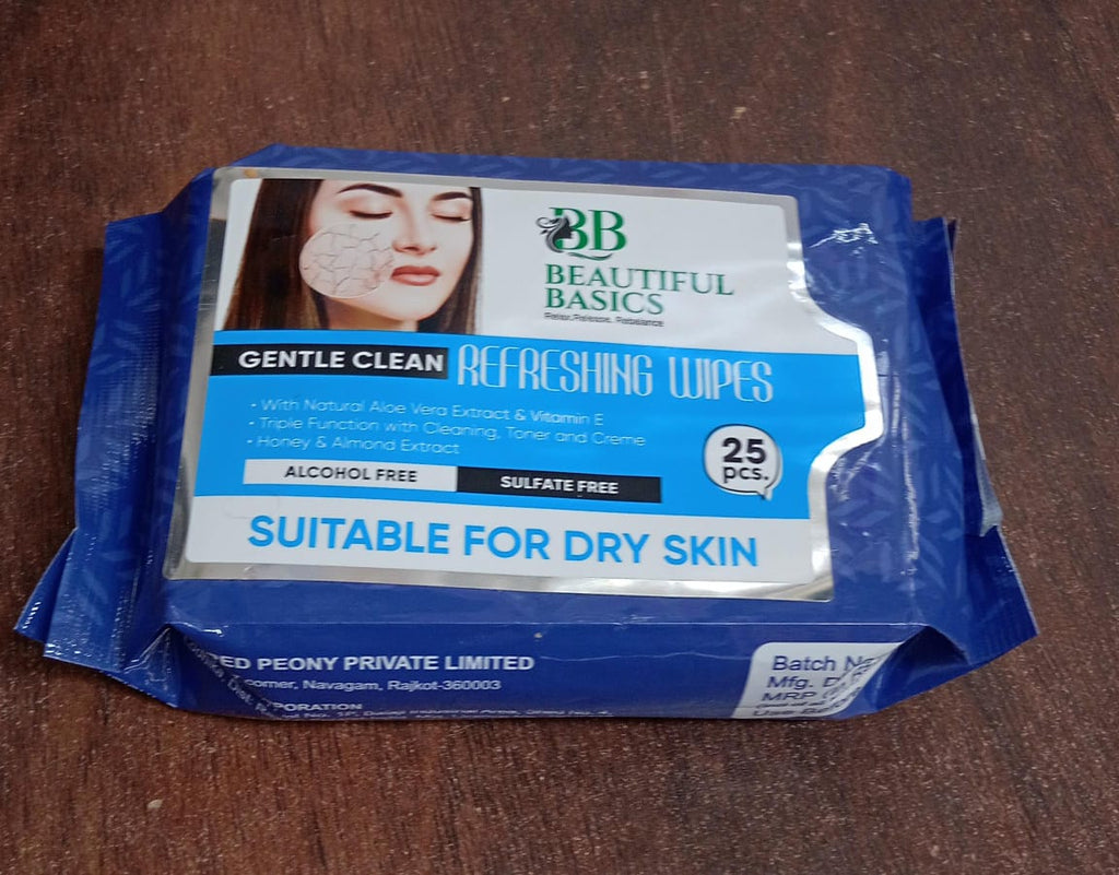 Alcohol-free wet wipes pack with fruit illustrations and a hand.