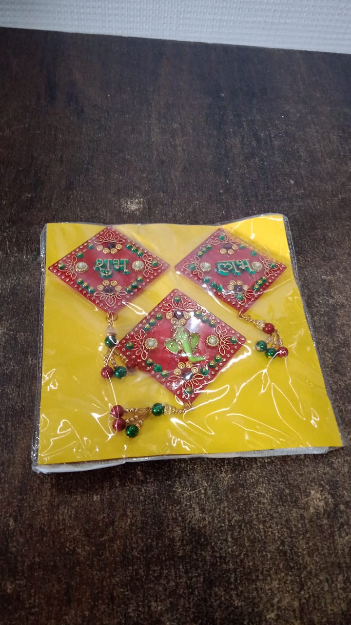 Decorative Shubh Labh Ganesh wall hanging set showcased on wall display
