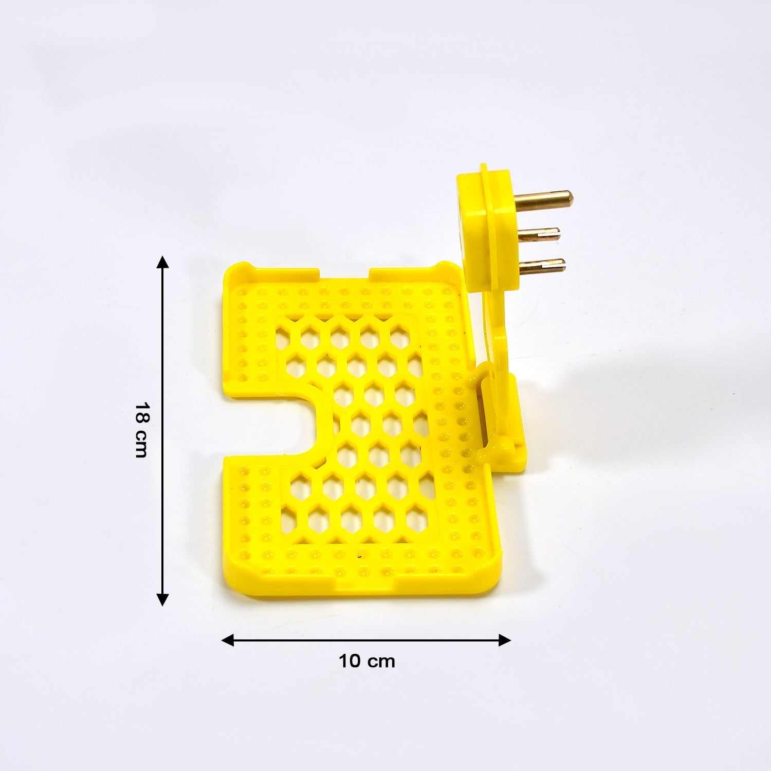 Detail of the three-pin design of the yellow mobile charging wall holder for secure fit.