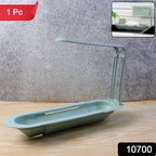 Adjustable kitchen sink rack organiser with cleaning tools on countertop