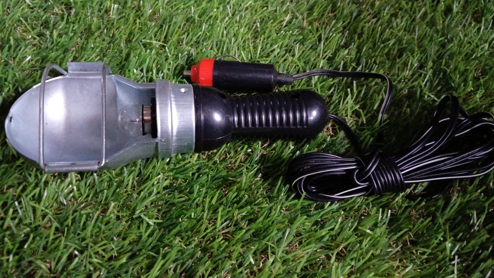 Side view of the BoltForce Handheld Work Light, showcasing its robust build.