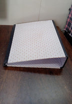 Side view of the button clip box file, highlighting its compact design.