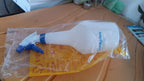 Multipurpose plastic spray bottle with 1 litre capacity on green background