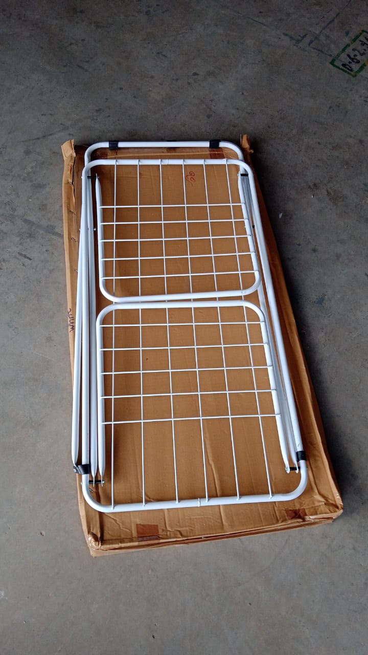 Portable foldable laundry drying stand with cross-leg base on balcony
