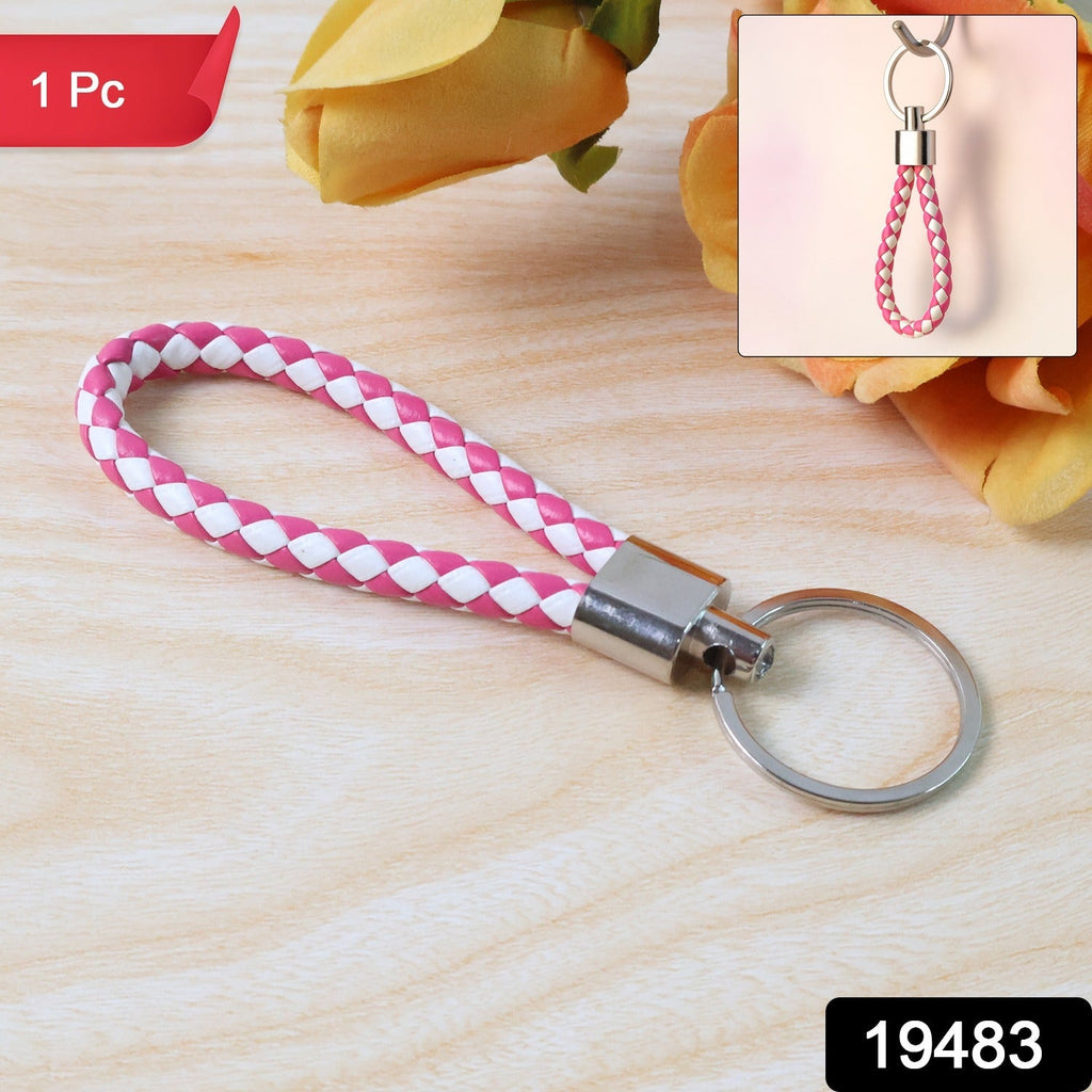 Close-up view of braided two-tone leather-style keychain with metal ring